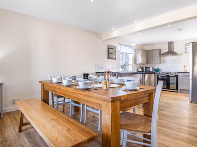 Open-plan kitchen diner with oak dining table