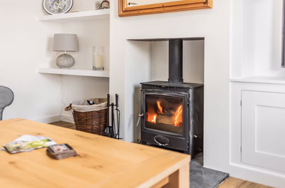 Grey shaker kitchen with white subway tiles and blue border
